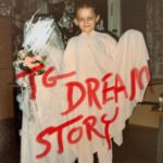 Zdjęcie przedstawia dziecko i czerwony napis TG Dream Story